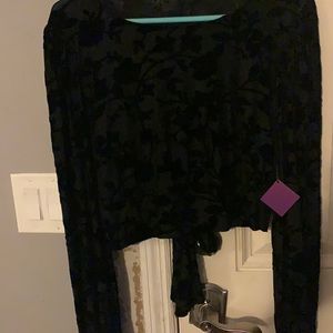 Long sleeved floral imprinted shirt.